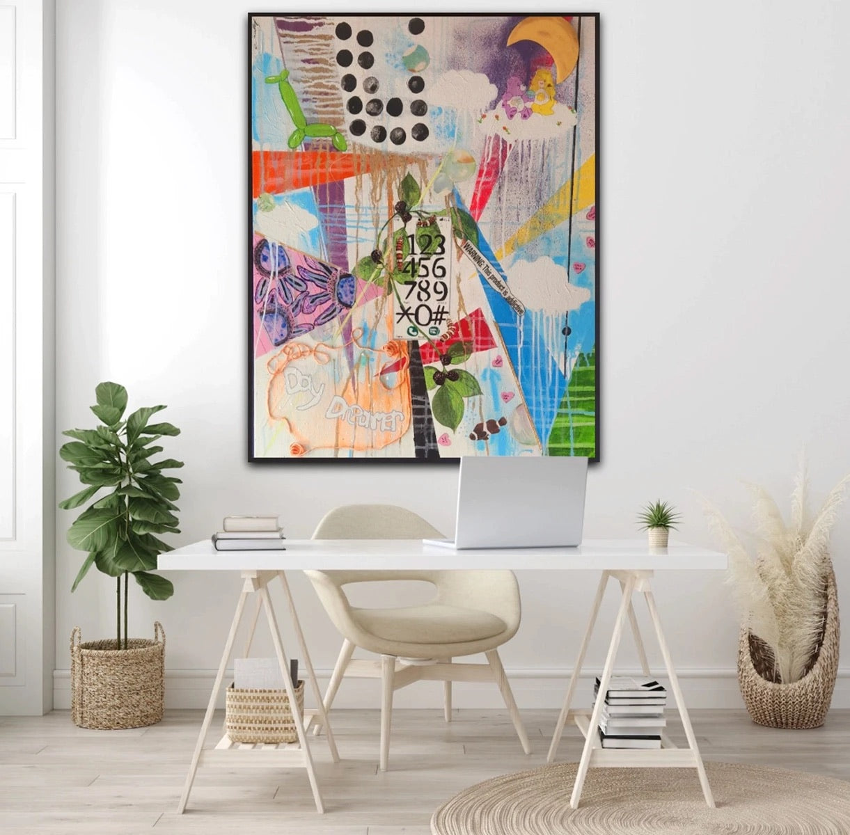 A colourful Keshida Layone painting hung above a white desk